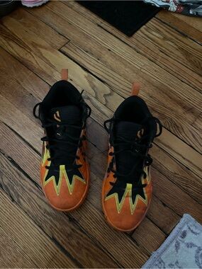 Puma Kids' Orange and Black Athletic Shoes with Yellow Accents the Cheetos